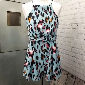 Playful romper! Cheetah print romper size medium by she and sky
